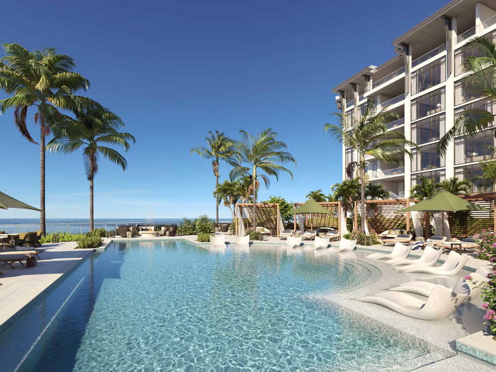 Gulf-front resort pool deck at Rosewood Residences Naples
